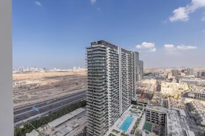 a view of a tall building in a city at Sky-High Serenity - Stylish 1BHK - 20th Floor in Dubai