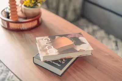 a book sitting on top of a table at Damac Waves Tower Dubai Marina - By Home Of Choice in Dubai