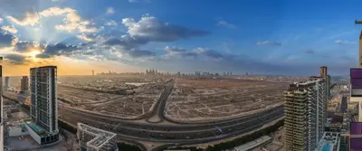 an aerial view of a city with buildings and roads at Chic 1-Bedroom in Binghatti House JVC in Dubai
