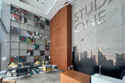 a lobby of a store with a sign on the wall at GuestReady - Exquisite living with Marina views in Dubai