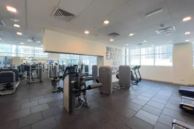 a gym with treadmills and equipment in a building at GuestReady - Downtown charm with skyline views in Dubai