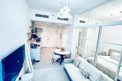 a living room with a couch and a table at One bedroom apartment brand new Dubai Hills ultra luxury furniture in Dubai