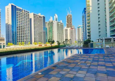 a swimming pool in a city with tall buildings at HiGuests - Vibrant 1BR in Business Bay in Dubai