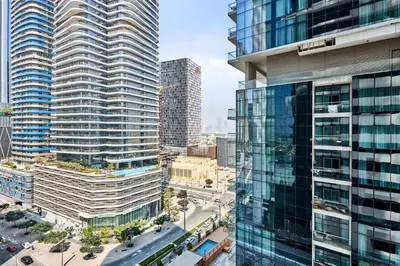 an aerial view of a city with tall buildings at Downtown 1BR - 5 minutes to mall - panoramic pool in Dubai