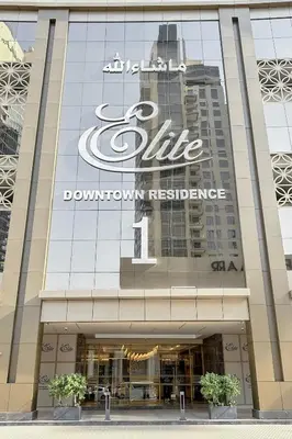 a sign on the side of a building at Clever Guest 002 Elite Downtown in Dubai
