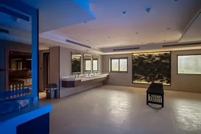 a large bathroom with two sinks and a mirror at Clever Guest 002 Elite Downtown in Dubai