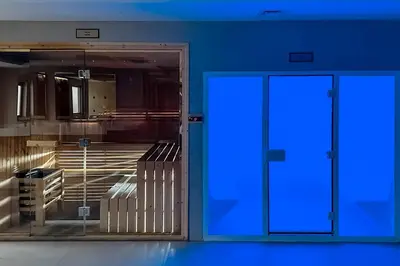 an open door with blue light in a room at Clever Guest 002 Elite Downtown in Dubai