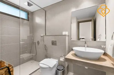 a bathroom with a sink and a toilet and a shower at Keysplease 4BR, Garden BBQ, Malibu Beach Access, Damac Hills 40 in Dubai