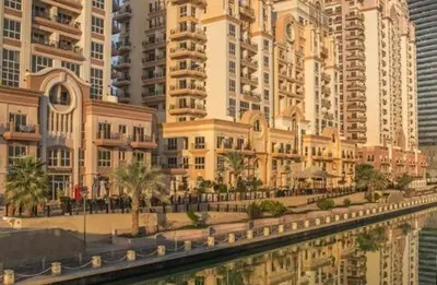 a city with tall buildings next to a body of water at Huge Exclusive Comfortable Studio With Canal View! in Dubai