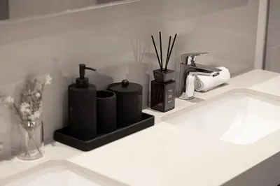 a bathroom counter with a sink with a faucet at Luxury 2BR Burj Khalifa View Dubai Mall in Dubai