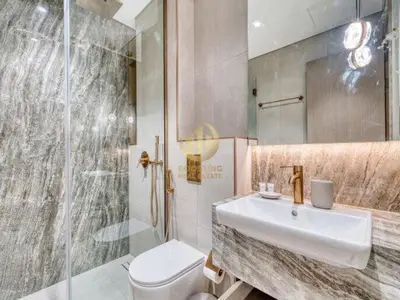 a bathroom with a toilet and a sink and a shower at Luxury 1BR Larger Layout Westwood Grande - 1103 in Dubai