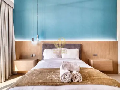 a bedroom with a bed with towels on it at Luxury 1BR Larger Layout Westwood Grande - 1103 in Dubai