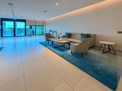 a living room with a couch and a table at Frank Porter - Address JBR in Dubai