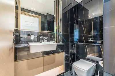 a bathroom with a sink and a toilet at Delightful 1BR in Binghatti Corner, Jumeirah Village Circle by Deluxe Holiday Homes in Dubai