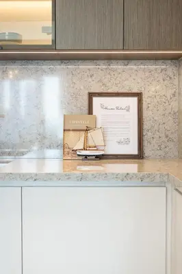 a picture of a model boat in a frame on a counter at Grand Bleu 02 - LIMITED OFFER! 1BR Coastal Retreat at Emaar Beachfront in Dubai