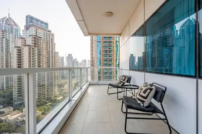 a balcony with two chairs and a view of the city at GuestReady - Coastal vibes in Dubai Marina in Dubai