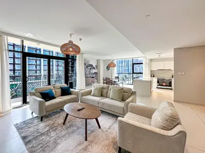 a living room with two couches and a table at Elegant 3 Bed in Park Point, Dubai Hills Estate in Dubai