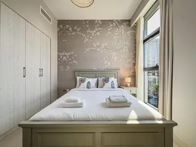 a bedroom with a bed with two pillows on it at Elegant 3 Bed in Park Point, Dubai Hills Estate in Dubai