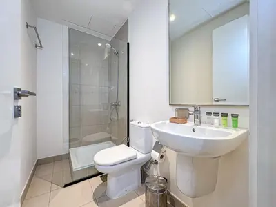 a bathroom with a toilet and a sink and a shower at Elegant 3 Bed in Park Point, Dubai Hills Estate in Dubai