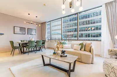 a living room with a couch and a table at Modern 2BR in Sky Gardens, DIFC by Deluxe Holiday Homes in Dubai