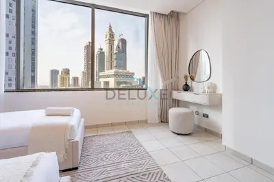 a white bedroom with a view of the city at Modern 2BR in Sky Gardens, DIFC by Deluxe Holiday Homes in Dubai