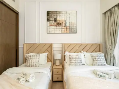 two beds sitting next to each other in a bedroom at Signature Series 1 Bedroom Apartment I Free Parking, Gym, Pool I PlayStation 5 I by Skyline Serenity in Dubai