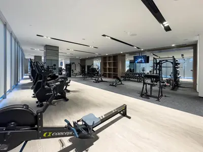 a gym with treadmills and exercise equipment in a building at Signature Series 1 Bedroom Apartment I Free Parking, Gym, Pool I PlayStation 5 I by Skyline Serenity in Dubai