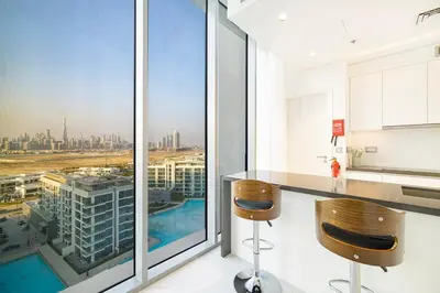 a kitchen with a counter and a view of a city at Luxury 2BR Prime Location & Burj Views in Dubai