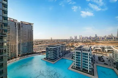 a view of the city from a building with a swimming pool at Luxury 2BR Prime Location & Burj Views in Dubai