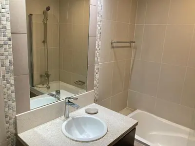 a bathroom with a sink and a bath tub at Executive Tower 1bhk Business Bay in Dubai