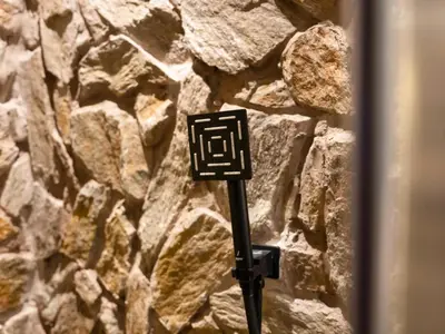a sign on the side of a stone wall at Luxury Penthouse In The Heart of Dubai Marina in Dubai