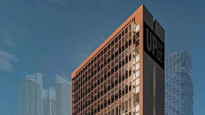 a building with a street sign on the side of it at Upside Living Business Bay Stunning Panoramic Burj Cityline Views by Simply Comfort in Dubai