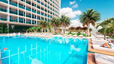 a large swimming pool with palm trees and a building at Upside Living Business Bay Stunning Panoramic Burj Cityline Views by Simply Comfort in Dubai
