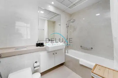 a bathroom with a tub and a sink and a shower at Spectacular 1BR in Botanica Tower 1 Dubai Marina by Deluxe Holidy Homes in Dubai