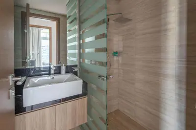 a bathroom with a sink and a shower at Frank Porter - Urban Oasis in Dubai