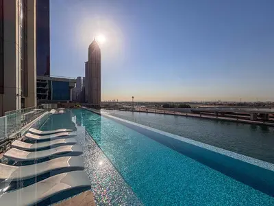 a large swimming pool on top of a building at Frank Porter - Urban Oasis in Dubai