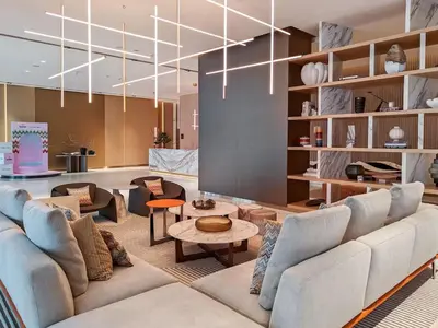 a living room with a couch and chairs and a table at FAM Living - Urban Oasis 2bedroom, Business Bay in Dubai