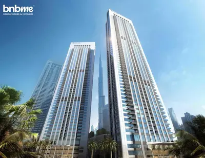 two tall buildings in a city with palm trees at bnbme - Luxury 4BR Downtown Views II Apt Burj Khalifa Views Pool Gym Parking in Dubai