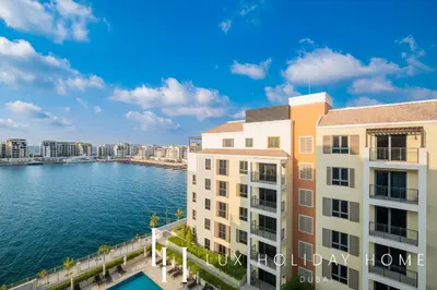 a view of the water from the balcony of a building at LUX The La Mer Infinity View- Luxury Boho Suite 2 in Dubai