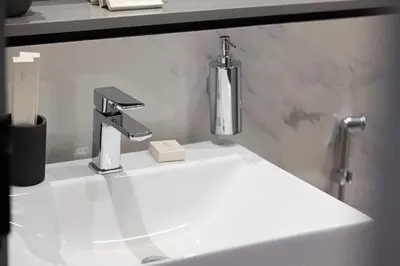 a bathroom sink with a faucet on top of it at MajeStay - MAG Living in Dubai