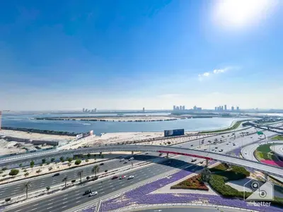 an aerial view of a highway with a bridge at Luxury One Bedroom with Balcony & partial Burj Khalifa View in Dubai