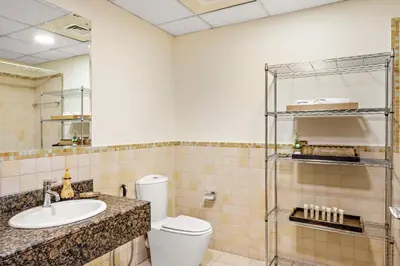 a bathroom with a toilet and a sink at JBR Beach 2Bed Apartment with Full Marina View in Dubai
