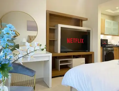 a hotel room with a television and a bed at Studio near beach and Metro in Dubai Marina Z1003 in Dubai