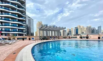 a swimming pool with a city skyline in the background at Stylist Studio in Marina near beach and Metro Z1103 in Dubai