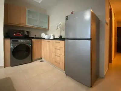 a kitchen with a stainless steel refrigerator and a dishwasher at Stylist Studio in Marina near beach and Metro Z1103 in Dubai