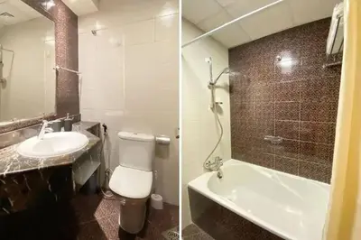 a bathroom with a sink and a toilet and a tub at Studio in Dubai Marina near beach and Metro Z514 in Dubai