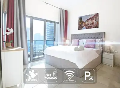 a bedroom with a bed and a large window at 1Bedroom Apartment in Dubai Marina near to beach & Metro Z1006 in Dubai