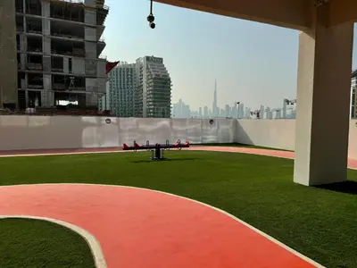 a picnic table on the roof of a building at Spacious Studio with Burj Khalifa Views in Dubai
