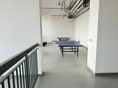 a room with two ping pong tables in it at Spacious Studio with Burj Khalifa Views in Dubai