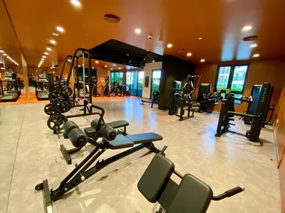 a gym with several exercise equipment in a room at La Mer Beach Jumeirah 1 bedroom hall Beach view balcony burj khalifa view walk distance few steps by oima leasing property in Dubai